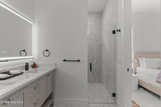 9213 Rivendell Pl SW, Calabash, NC 28467 - bathroom with a marble finish shower, double vanity, baseboards, and ensuite bathroom