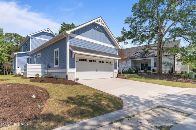9213 Rivendell Pl SW, Calabash, NC 28467 - view of front of property featuring board and batten siding, a garage, and driveway