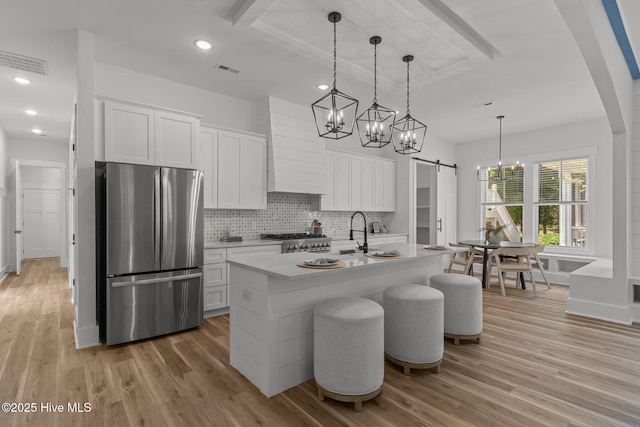 9213 Rivendell Pl SW, Calabash, NC 28467 - kitchen featuring freestanding refrigerator, a chandelier, light wood-style floors, light countertops, and beamed ceiling