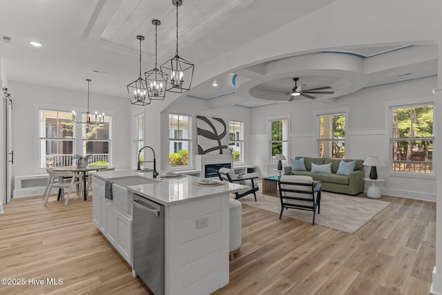 9213 Rivendell Pl SW, Calabash, NC 28467 - kitchen featuring a sink, dishwasher, light wood-type flooring, ceiling fan, and recessed lighting