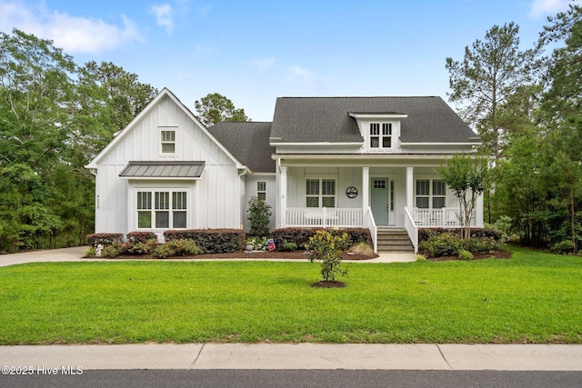 view of front of house featuring board and batten siding, covered porch, a front yard, and a shingled roof