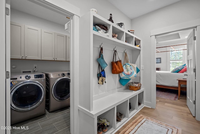 mudroom featuring washer and clothes dryer and light wood-type flooring
