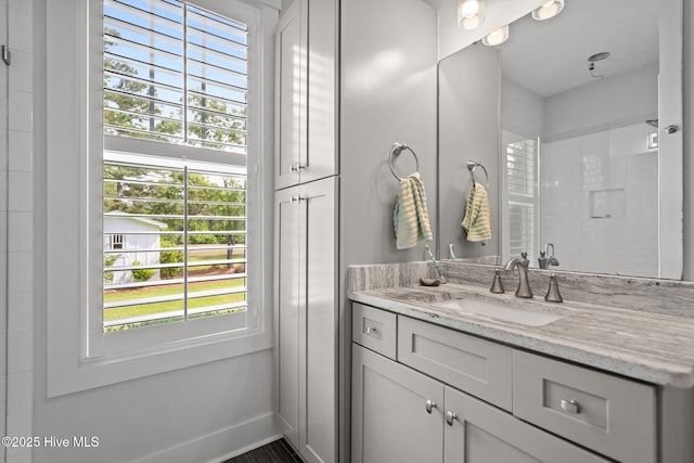 bathroom with vanity and baseboards