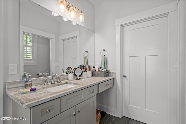 bathroom featuring vanity and baseboards