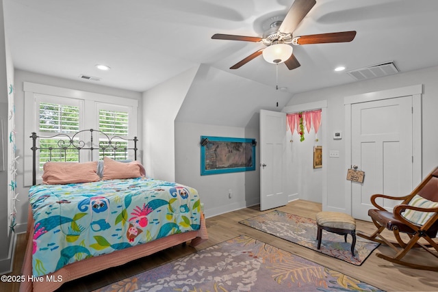bedroom featuring wood finished floors, baseboards, lofted ceiling, recessed lighting, and ceiling fan