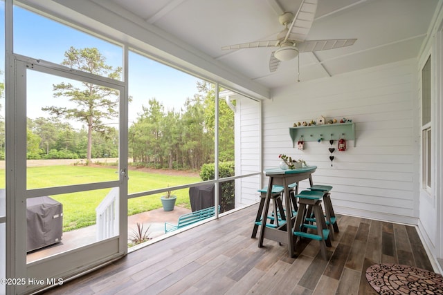 sunroom / solarium with ceiling fan and plenty of natural light