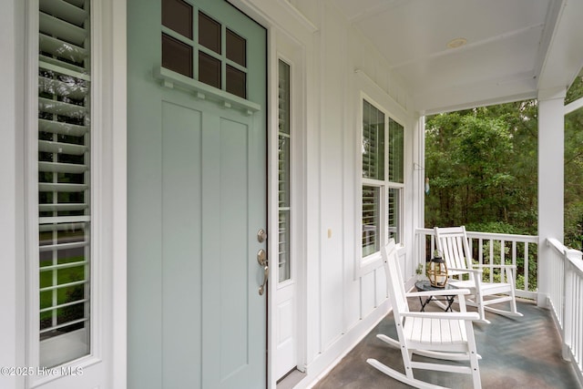 property entrance featuring covered porch