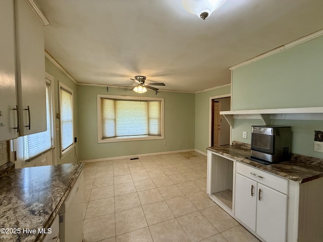 208 W Gray St, Windsor, NC 27983 - kitchen featuring ornamental molding, a ceiling fan, white cabinetry, light tile patterned floors, and baseboards