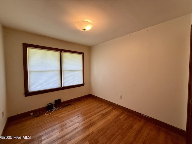 208 W Gray St, Windsor, NC 27983 - empty room featuring wood finished floors and baseboards