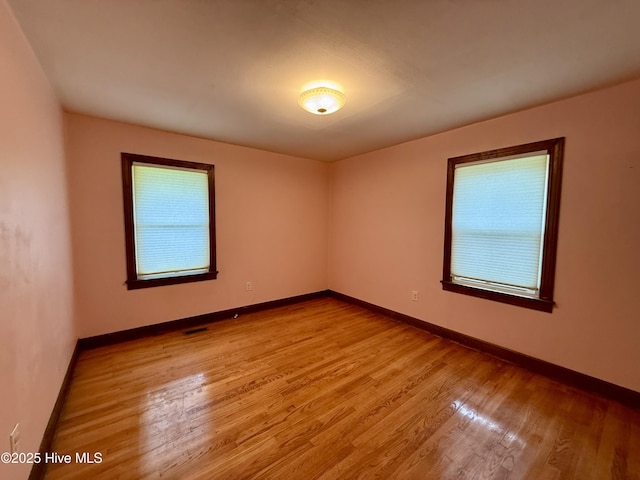 208 W Gray St, Windsor, NC 27983 - spare room with plenty of natural light, wood finished floors, and baseboards