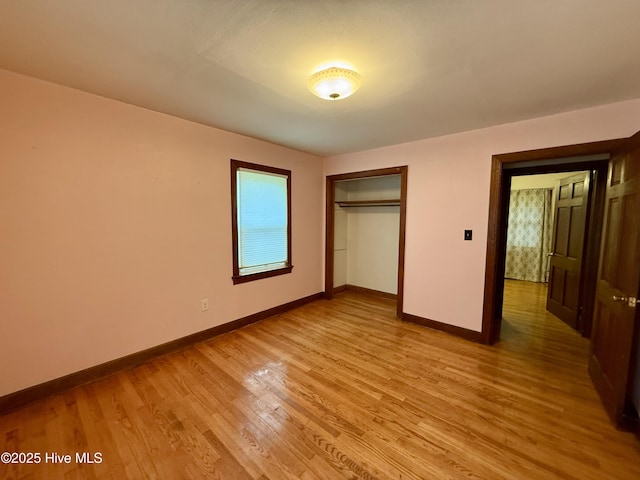 208 W Gray St, Windsor, NC 27983 - unfurnished bedroom featuring light wood finished floors, baseboards, and a closet