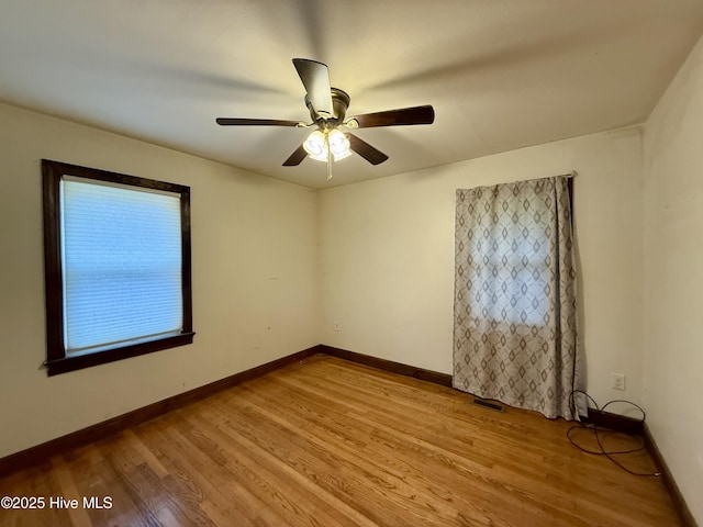 208 W Gray St, Windsor, NC 27983 - spare room featuring light wood finished floors, a ceiling fan, and baseboards
