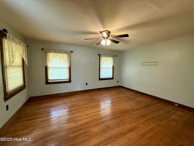 208 W Gray St, Windsor, NC 27983 - empty room with ceiling fan, wood finished floors, and baseboards