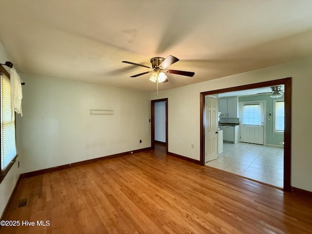 208 W Gray St, Windsor, NC 27983 - unfurnished room with a ceiling fan, light wood finished floors, and baseboards