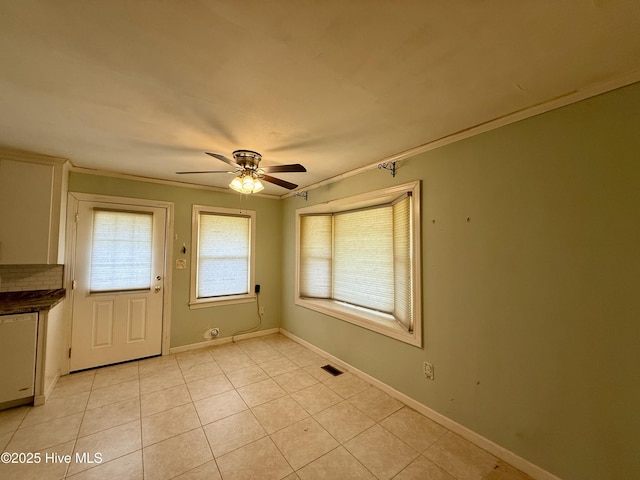 208 W Gray St, Windsor, NC 27983 - unfurnished dining area with ceiling fan, ornamental molding, light tile patterned floors, and baseboards