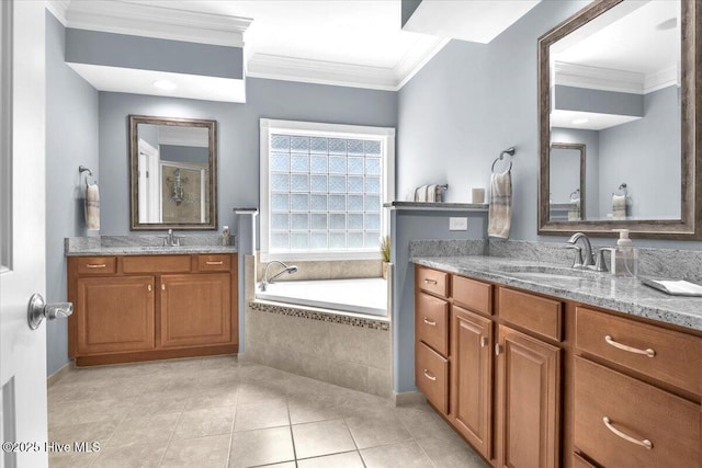 1013 Dowling Ct, Leland, NC 28451 - bathroom with tile patterned flooring, two vanities, a bath, ornamental molding, and baseboards