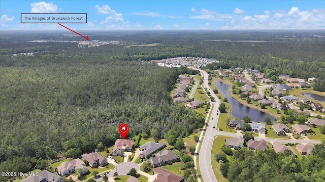 1013 Dowling Ct, Leland, NC 28451 - aerial overview of property's location featuring a heavily wooded area, nearby suburban area, and a large body of water