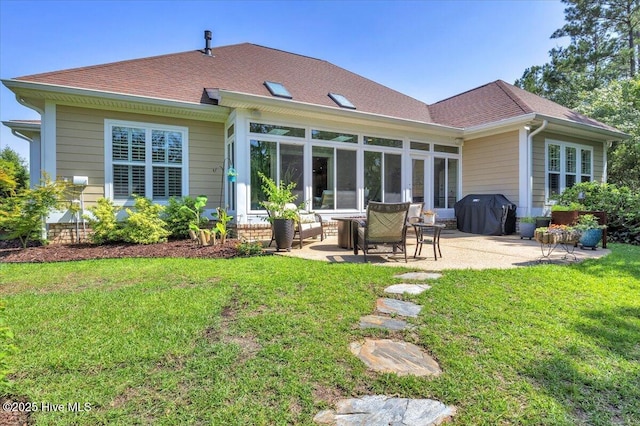 1013 Dowling Ct, Leland, NC 28451 - rear view of property featuring a patio area, a lawn, a shingled roof, and a sunroom