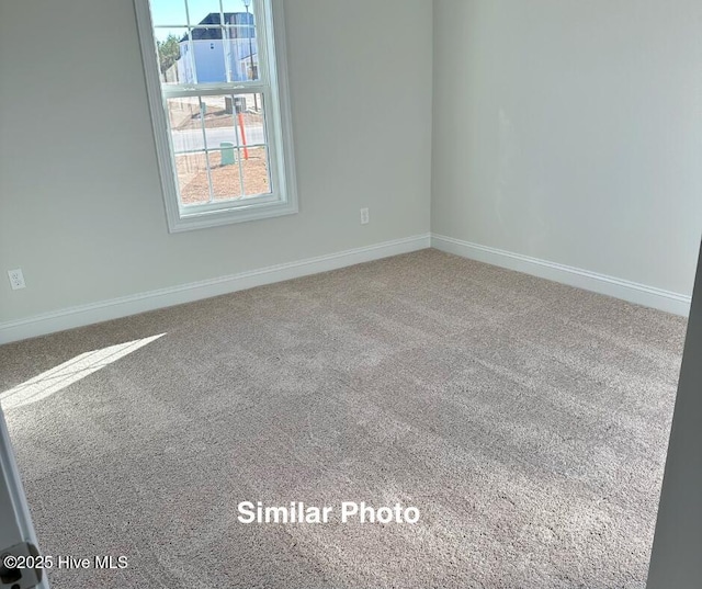 100 Sloth Ln, Jacksonville, NC 28546 - carpeted empty room featuring baseboards