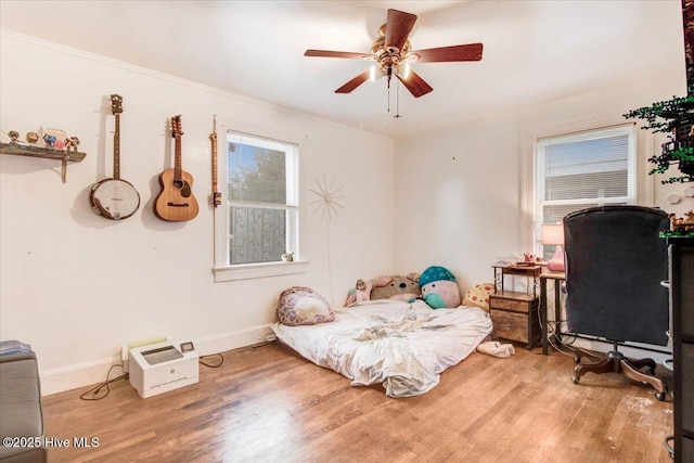 1605 E Holly St, Goldsboro, NC 27530 - bedroom featuring light wood-style flooring, ornamental molding, baseboards, and ceiling fan