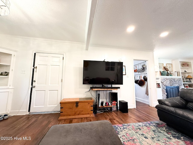 1605 E Holly St, Goldsboro, NC 27530 - living area featuring wood finished floors, a textured ceiling, beamed ceiling, and crown molding