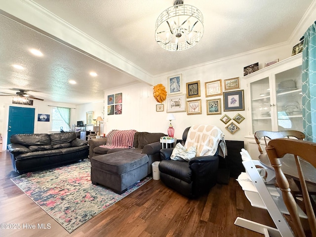 1605 E Holly St, Goldsboro, NC 27530 - living area with a chandelier, wood finished floors, crown molding, a textured ceiling, and ceiling fan