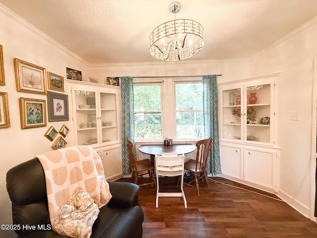 1605 E Holly St, Goldsboro, NC 27530 - dining area with a textured ceiling, a chandelier, dark wood finished floors, and crown molding