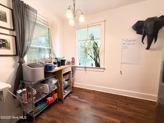 1605 E Holly St, Goldsboro, NC 27530 - office area featuring dark wood-style flooring, a chandelier, and healthy amount of natural light