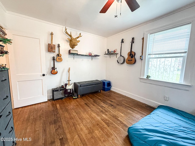 1605 E Holly St, Goldsboro, NC 27530 - bedroom featuring crown molding, wood finished floors, and a ceiling fan
