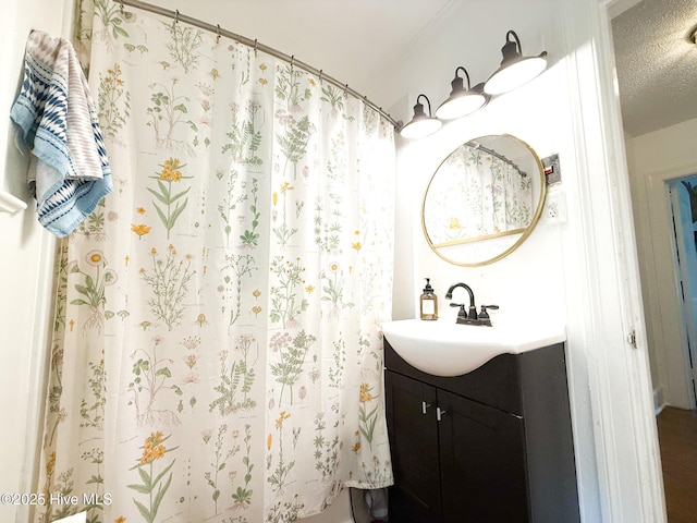 1605 E Holly St, Goldsboro, NC 27530 - full bath with vanity, a shower with shower curtain, and a textured ceiling