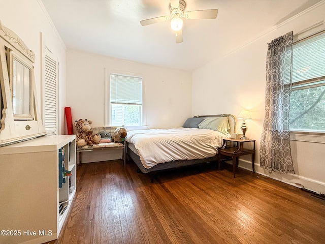 1605 E Holly St, Goldsboro, NC 27530 - bedroom featuring dark wood-type flooring, multiple windows, crown molding, and ceiling fan