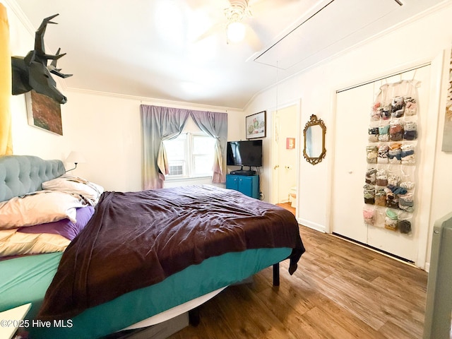 1605 E Holly St, Goldsboro, NC 27530 - bedroom featuring attic access, wood finished floors, vaulted ceiling, ornamental molding, and a ceiling fan