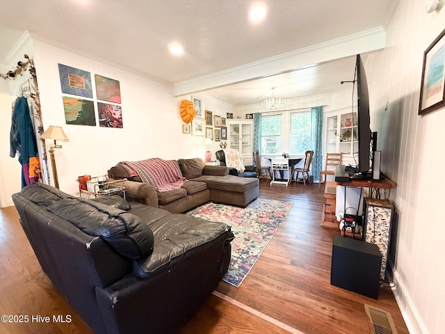 1605 E Holly St, Goldsboro, NC 27530 - living area with ornamental molding, wood finished floors, and recessed lighting