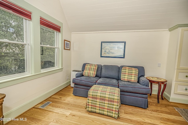 659 Wash Woods Way, Bald Head Island, NC 28461 - living area with lofted ceiling, light wood-type flooring, and baseboards