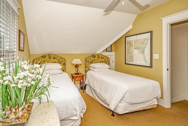 659 Wash Woods Way, Bald Head Island, NC 28461 - bedroom featuring carpet flooring, vaulted ceiling, and a ceiling fan