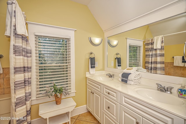 659 Wash Woods Way, Bald Head Island, NC 28461 - bathroom with plenty of natural light, lofted ceiling, double vanity, tile patterned floors, and curtained shower