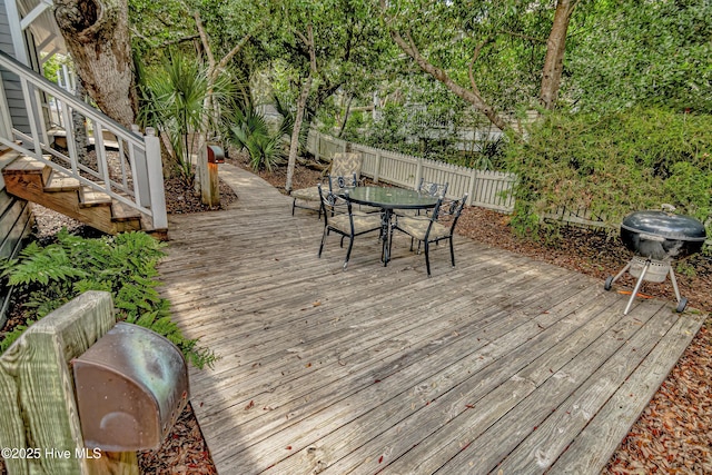 659 Wash Woods Way, Bald Head Island, NC 28461 - deck with outdoor dining space and stairway