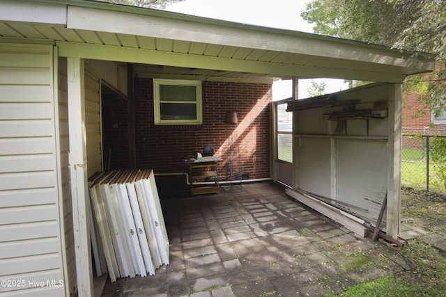 view of patio / terrace featuring fence