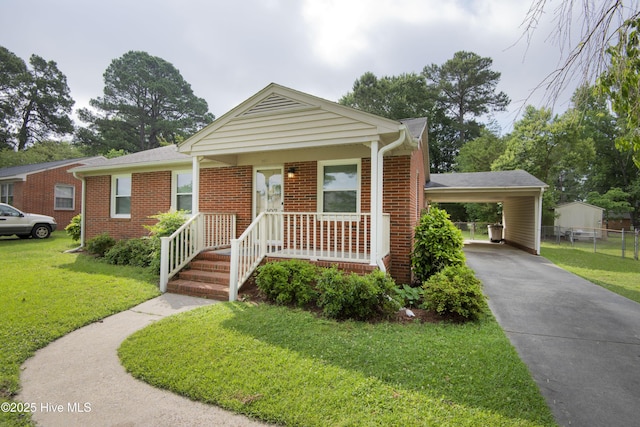 view of front of property featuring concrete driveway, a carport, and brick siding