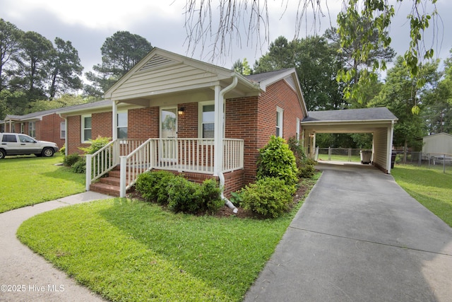 view of front of house featuring concrete driveway, brick siding, and an attached carport