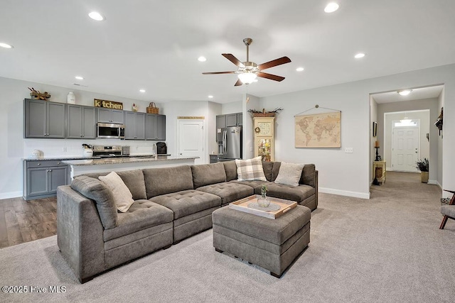 1592 E New Carraway Pl SE, Bolivia, NC 28422 - living room featuring recessed lighting, baseboards, a ceiling fan, and light colored carpet