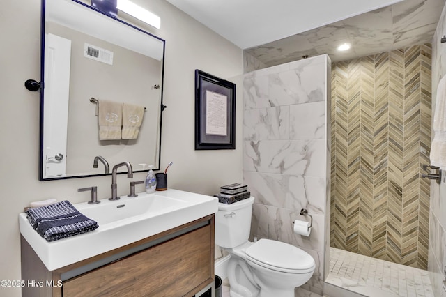 bathroom featuring toilet, walk in shower, and vanity