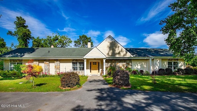4512 Rivershore Dr, New Bern, NC 28560 - ranch-style home featuring stone siding, a front lawn, and a chimney