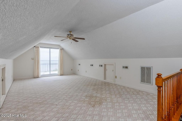 4512 Rivershore Dr, New Bern, NC 28560 - additional living space with carpet, vaulted ceiling, a textured ceiling, baseboards, and a ceiling fan