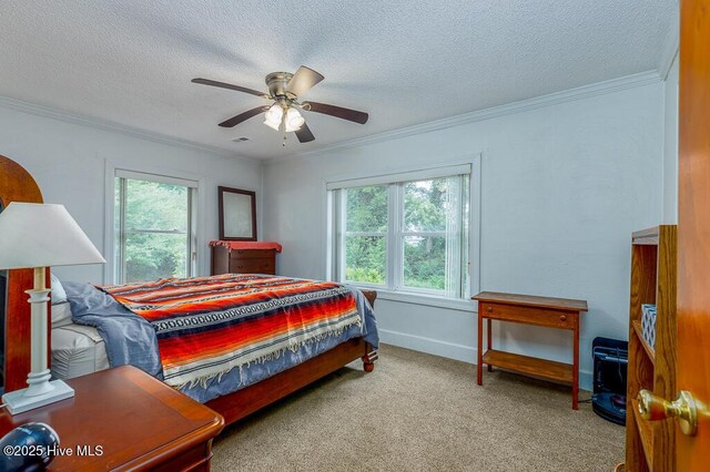 4512 Rivershore Dr, New Bern, NC 28560 - carpeted bedroom with multiple windows, ornamental molding, a textured ceiling, and a ceiling fan