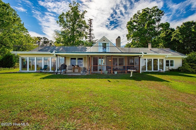 4512 Rivershore Dr, New Bern, NC 28560 - back of property featuring a sunroom, a lawn, and a chimney
