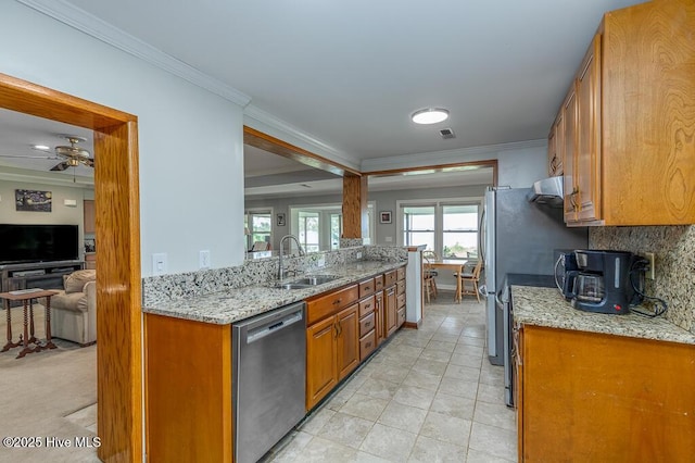 4512 Rivershore Dr, New Bern, NC 28560 - kitchen featuring stainless steel dishwasher, a sink, brown cabinets, ornamental molding, and ceiling fan