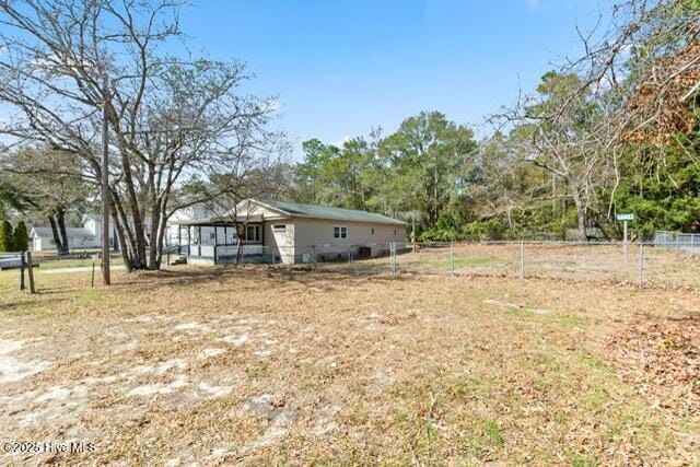 660 Beachview Dr SE, Bolivia, NC 28422 - view of yard featuring fence