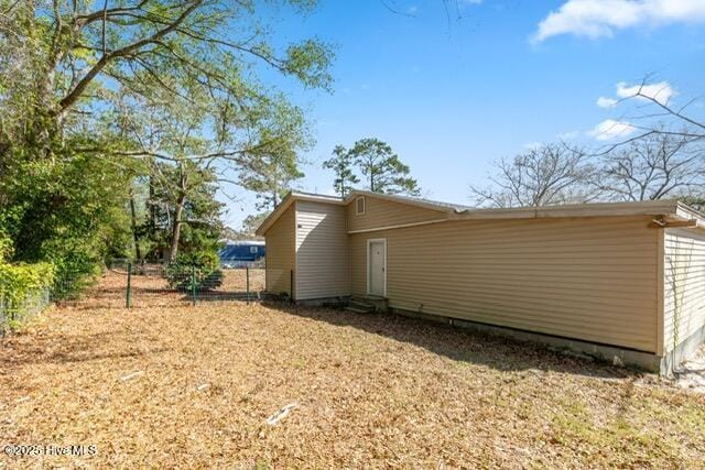 660 Beachview Dr SE, Bolivia, NC 28422 - view of home's exterior with entry steps and fence
