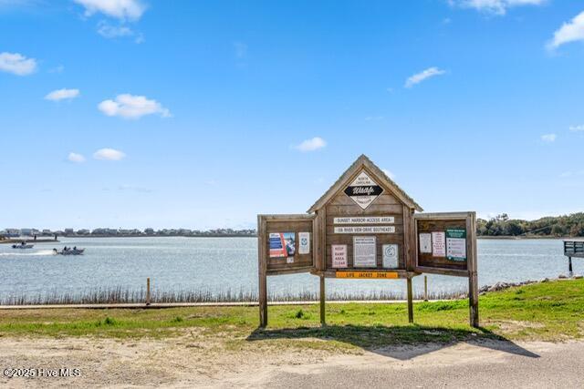 660 Beachview Dr SE, Bolivia, NC 28422 - dock featuring a water view